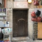 Door leading to Church of St John the Baptist among Muristan market shops (Seetheholyland.net)