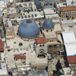 The Church of the Holy Sepulchre from above, huddled in by surrounding buildings (Ilan Arad / Wikimedia)