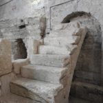 Crusader steps leading to grille offering a view into venerated cave (© Gregory Jenks)