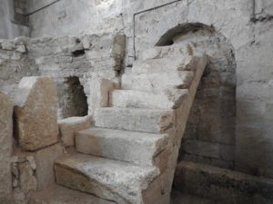 Crusader steps leading to grille offering a view into venerated cave (© Gregory Jenks)