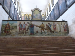 Depiction of Jesus carrying his cross, on top step of stairs to original Holy Sepulchre church (Seetheholyland.net)