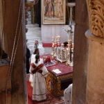 Greek Orthodox clergy at altar in the Katholikon (Seetheholyland.net)