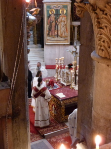 Greek Orthodox clergy at altar in the Katholikon (Seetheholyland.net)