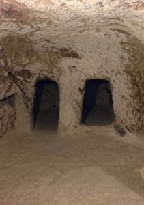 Kokhim tombs inside the venerated cave (© Gregory Jenks)