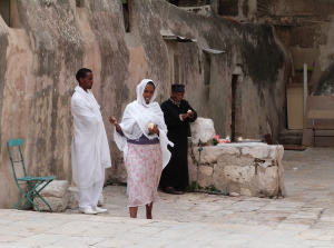 Members of Ethiopian Orthodox community at lunch on roof of Church of the Holy Sepulchre (Seetheholyland.net)