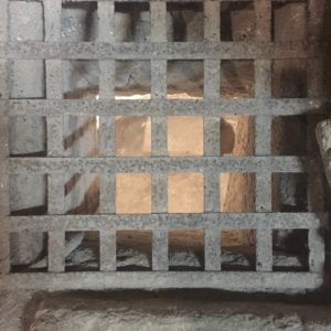 Metal grille, probably Crusader, placed to allow pilgrims to view the cave-church altar (© Gregory Jenks)