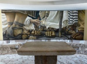 Encounter Chapel mural, by Chilean artist Daniel Cariola, depicts the woman who sought healing by touching the hem of Jesus’ cloak in Mark 5:25-34 (Seetheholyland.net)