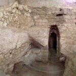 Panoramic view of first-century house with surviving plaster at far left (© Gregory Jenks)