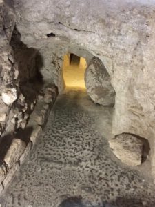 Rolling stone at entrance to burial cavities (© American Friends of the Episcopal Diocese of Jerusalem)