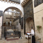 Russian nun praying in front of "Judgement Gate" threshold (Seetheholyland.net)