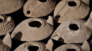 Oil lamps uncovered during the archaeological excavation at Salome's Cave. (©️Emil Eljam / Israel Antiquities Authority)