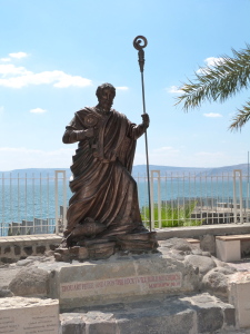 Statue of St Peter at Capernaum, with Sea of Galilee in background (Seetheholyland.net)
